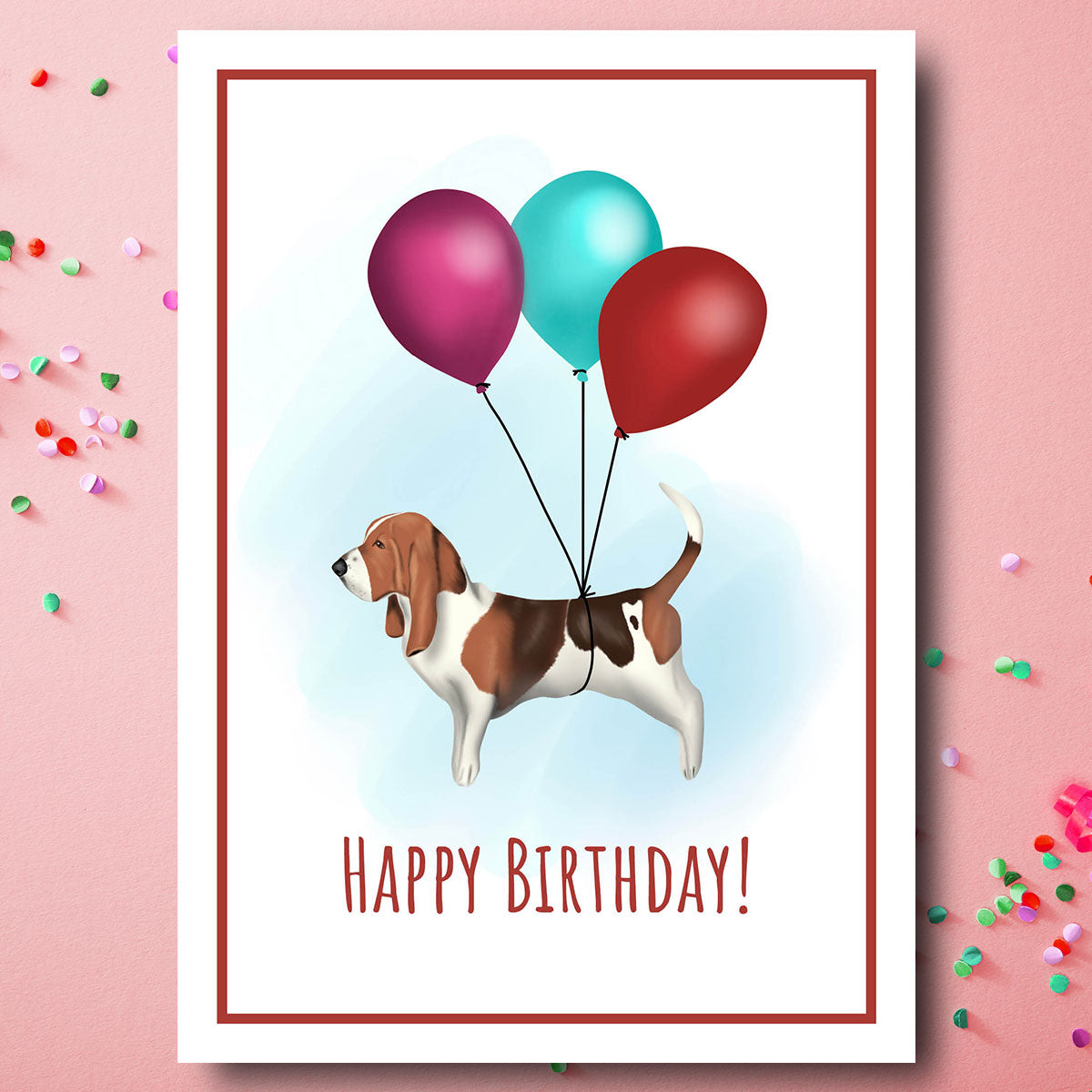Birthday card with Bassett Hound been carried of by a bunch of balloons