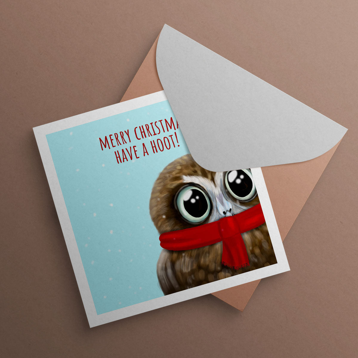 Owl wearing scarf with text Merry Christmas have a hoot. Christmas Card illustrated by Oundle Artist Kitty's Art