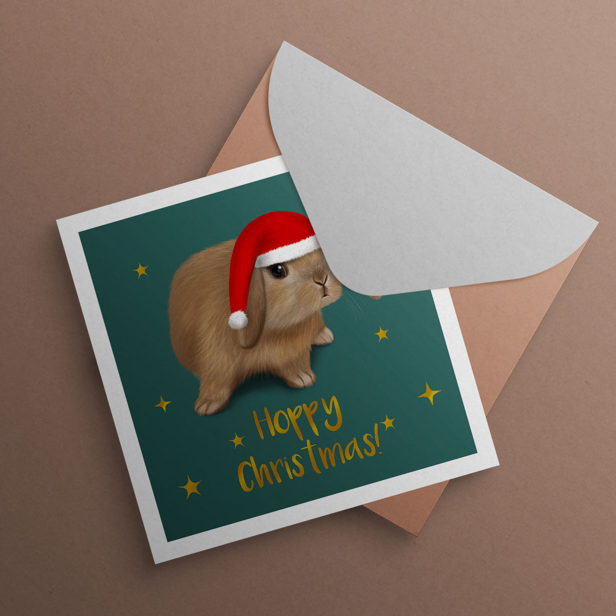 Mini Lop rabbit wearing Santa hat. Christmas Card illustrated by Oundle, Peterborough Artist Kitty's Art