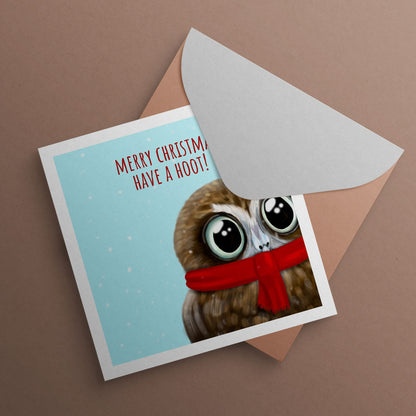 Owl wearing scarf with text Merry Christmas have a hoot. Christmas Card illustrated by Oundle Artist Kitty's Art