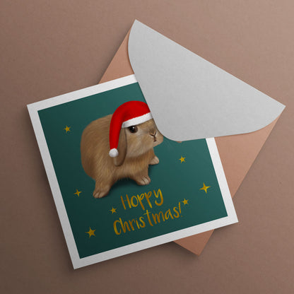 Mini Lop rabbit wearing Santa hat. Christmas Card illustrated by Oundle, Peterborough Artist Kitty's Art