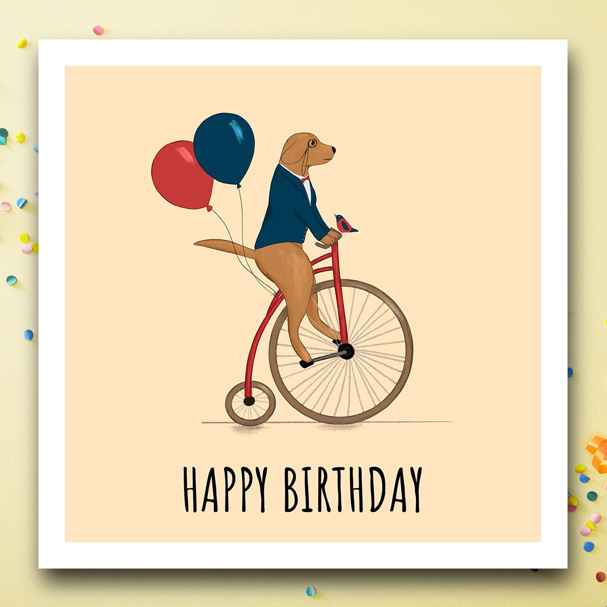 Birthday card with dog on unicycle with Happy birthday message