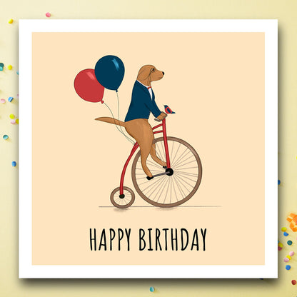 Birthday card with dog on unicycle with Happy birthday message