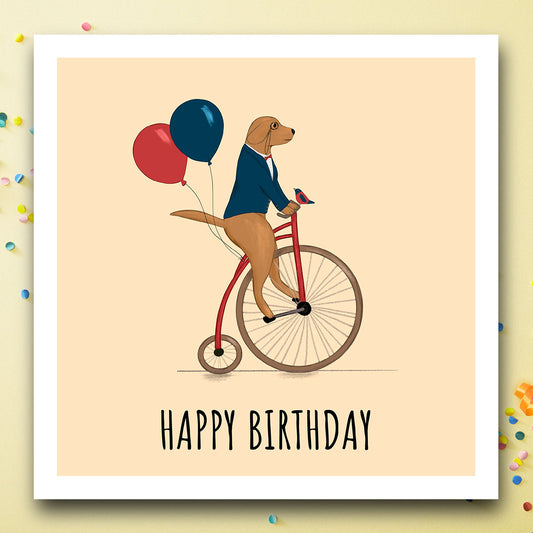 Birthday card with dog on unicycle with Happy birthday message